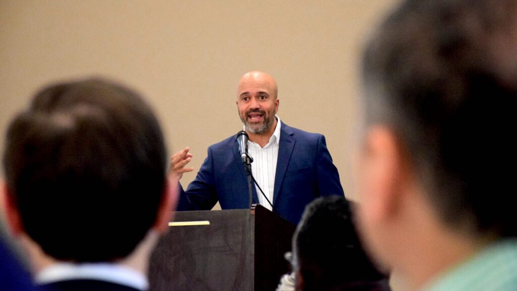 Carlos Whittaker speaks to the crowd at One Generation Away's 2022 Million Meal Spring Breakfast