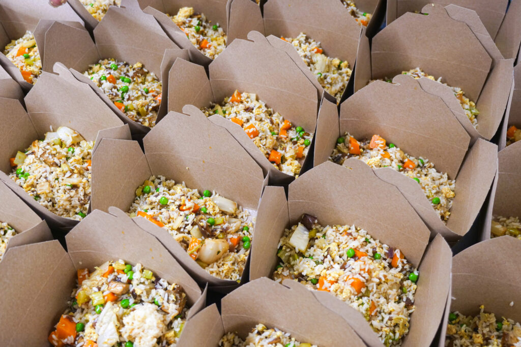 To-go boxes of fried rice