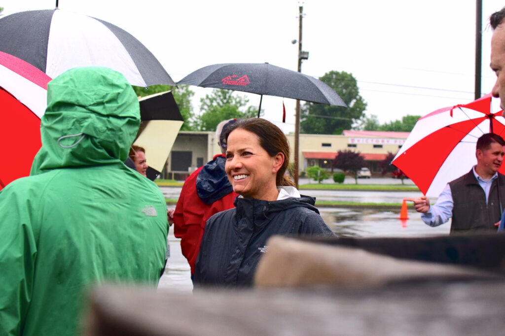 Maria Lee chats with a volunteer at a pop-upMobile Pantry distribution in Jonesborough Tennessee for foster families